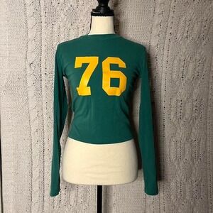 Like new Edikted green long sleeve top with yellow number 76. Size small
